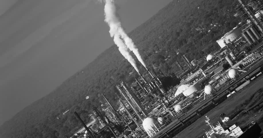 Panorama of an industrial area with chimneys that emit smoke and pollutants