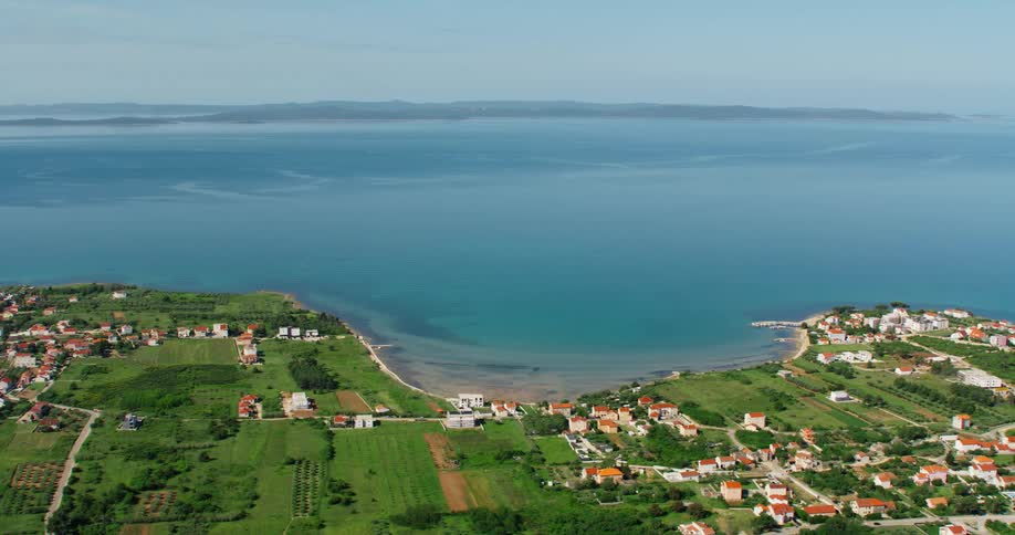 Aerial panorama of an urban city with houses by the sea