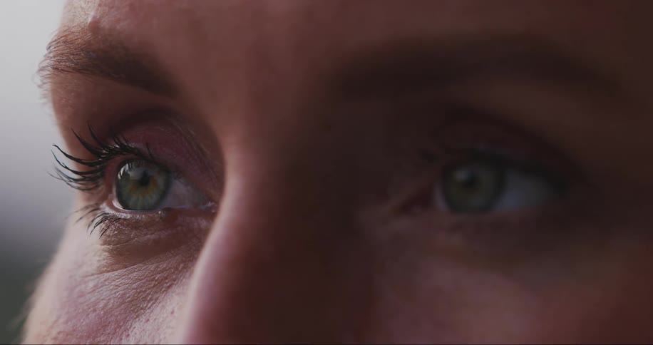 Extreme closeup on eyes and a woman opening up