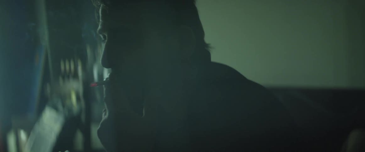 A man smokes a cigarette
