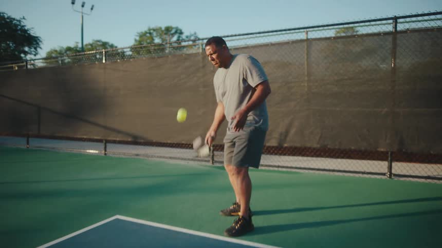 Man serving during a pickleball game