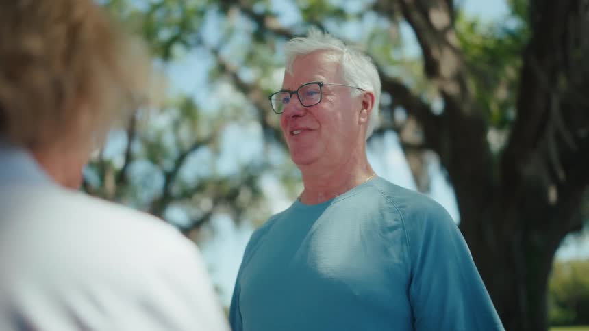 Older adults talking together outdoors