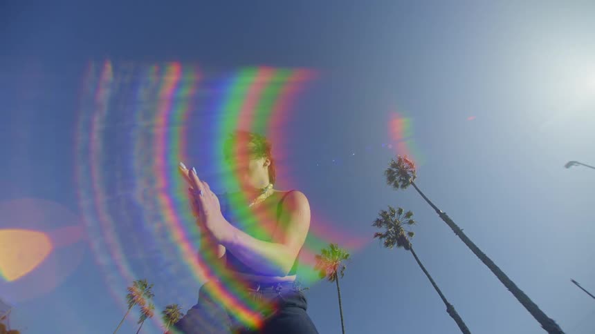 A white woman dances outdoors