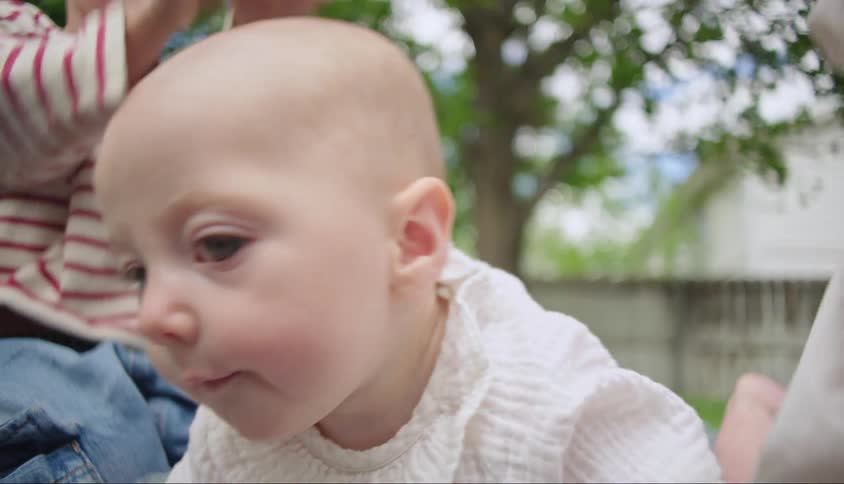 Portrait of a little baby in the backyard