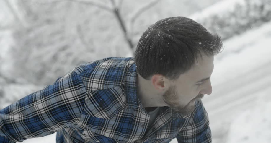 A man shovels snow