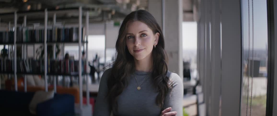 Woman crossing her arms indoors in an office