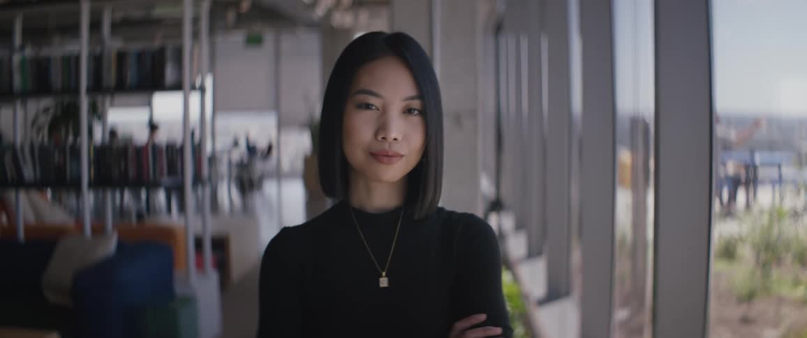 An asian women standing in an office building