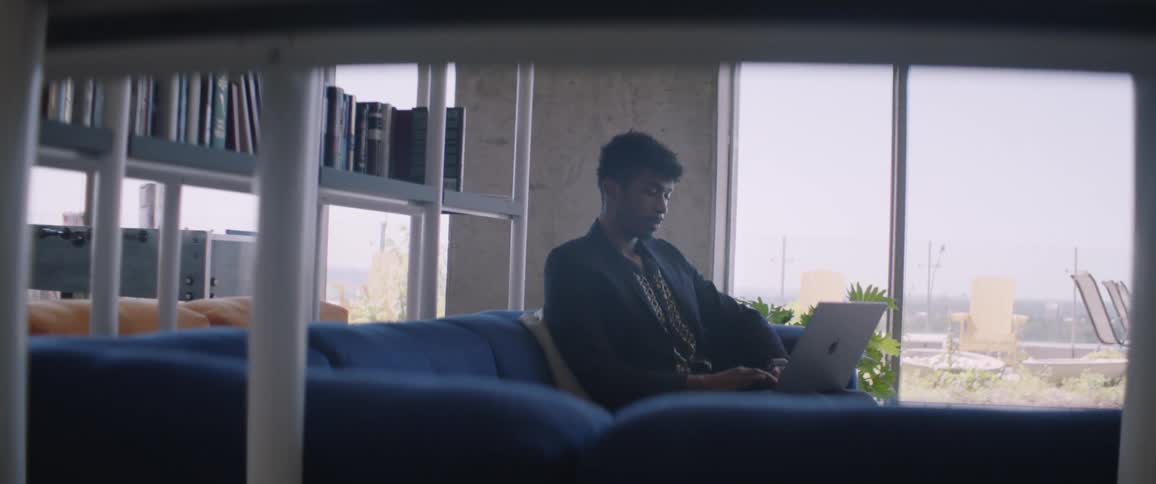 Man sitting working on a laptop