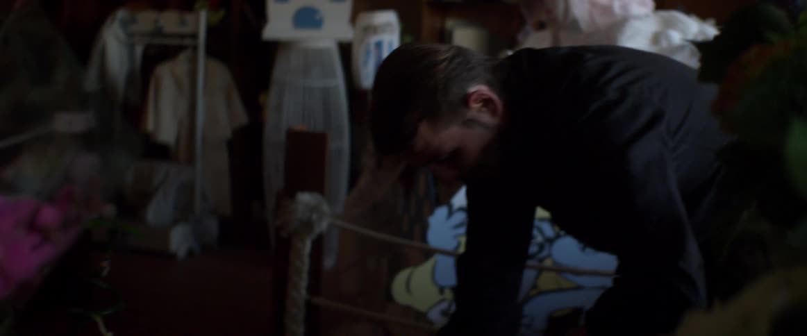 Man places flowers down in a shop