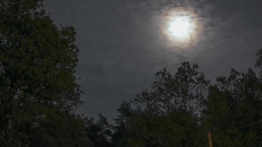 Clouds flow under the moonlight