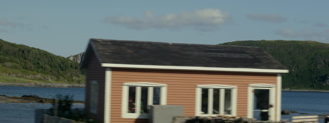 A small house on the coast of a lake