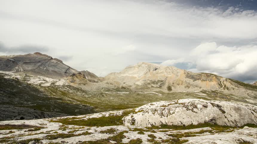 Heavy clouds flow over the mountains