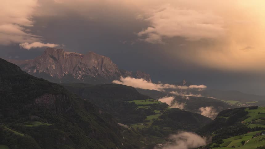 Panorama of mountain ranges with sunset sky