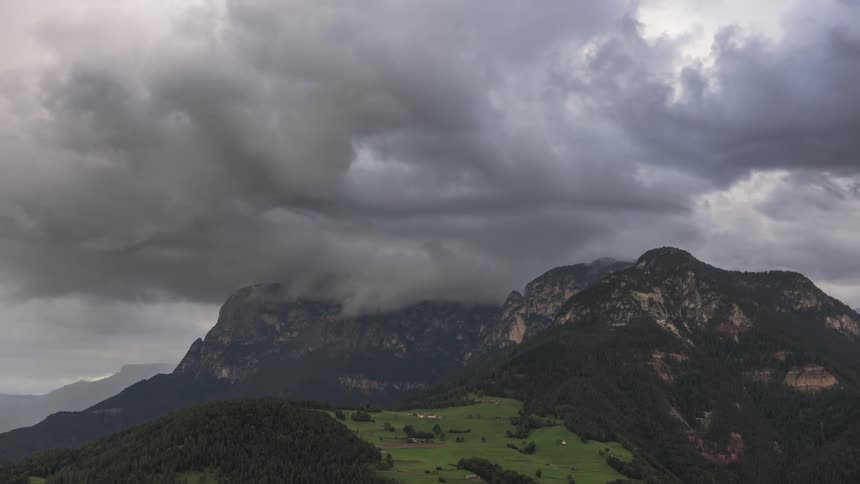 Mountainous landscape with dark clouds foreshadowing a storm