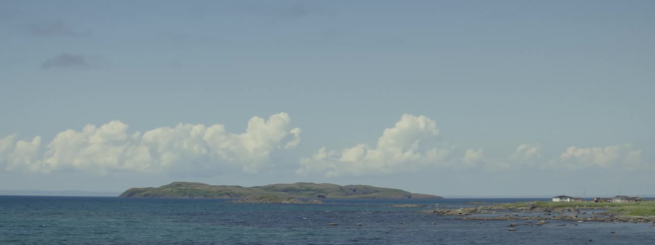 Ocean landscape with the coast on the horizon