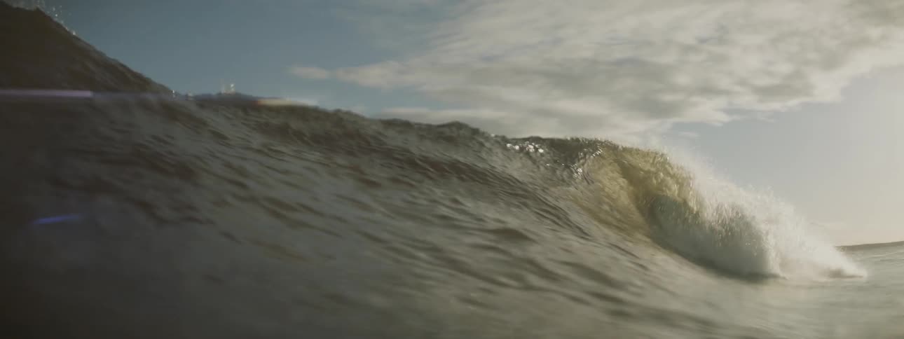 A wave is cresting and crashing