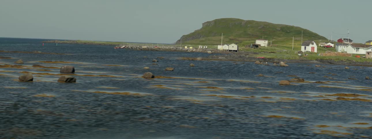 Oceanic landscape with colorful houses by the sea