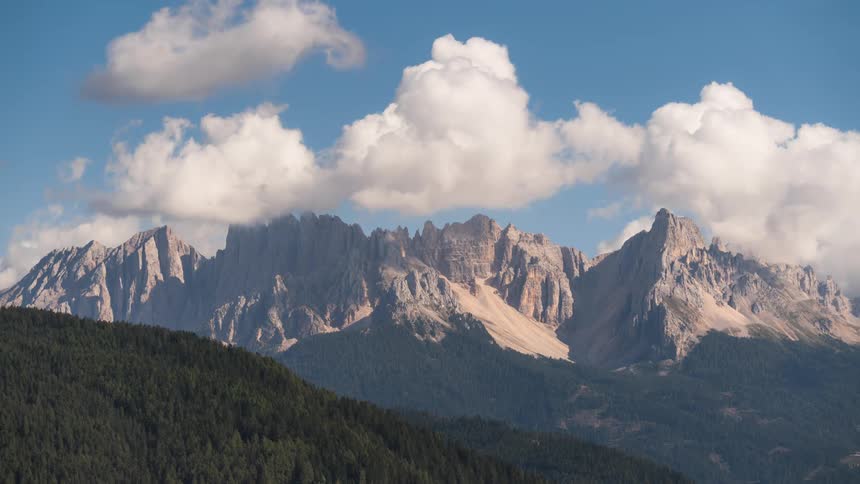 Mountain ranges with cliffs and greenish clouds around