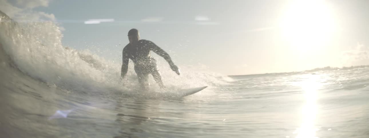 A surfer riding a very small wave