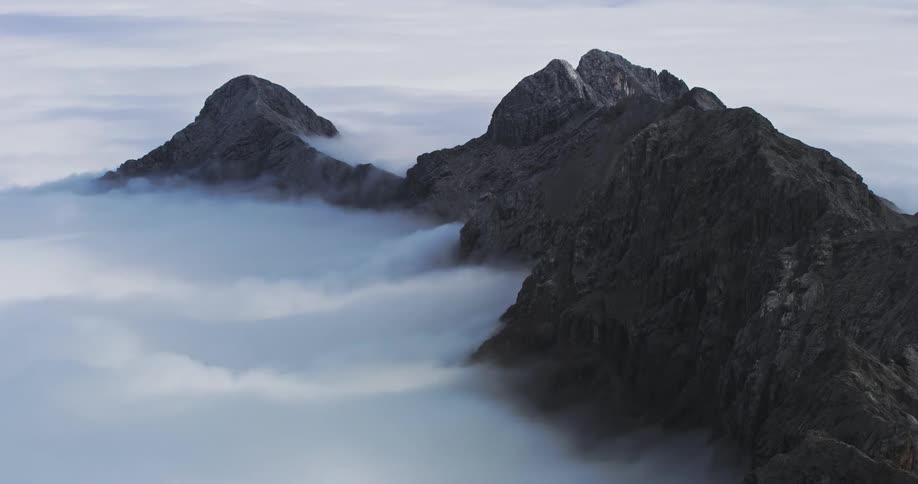 Mountain peaks with sea of clouds around