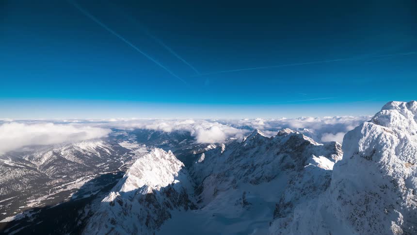 Rocky mountains with snow on a clear blue sky day