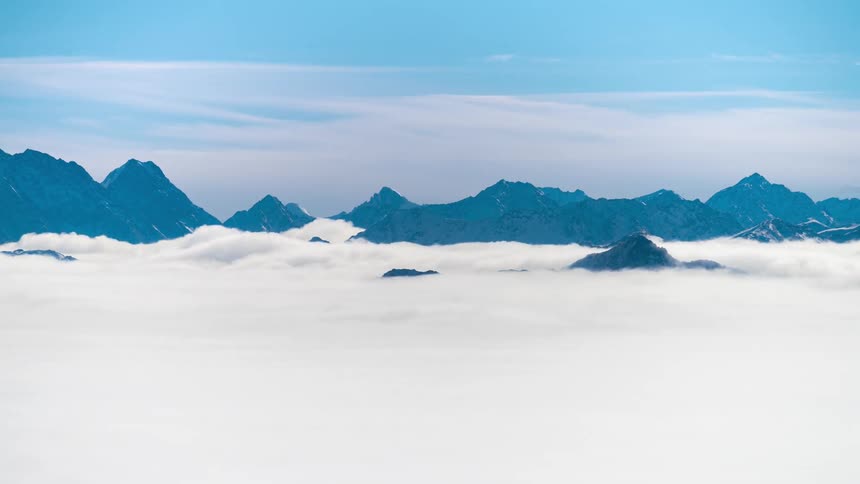 Heavy clouds flow on he mountains