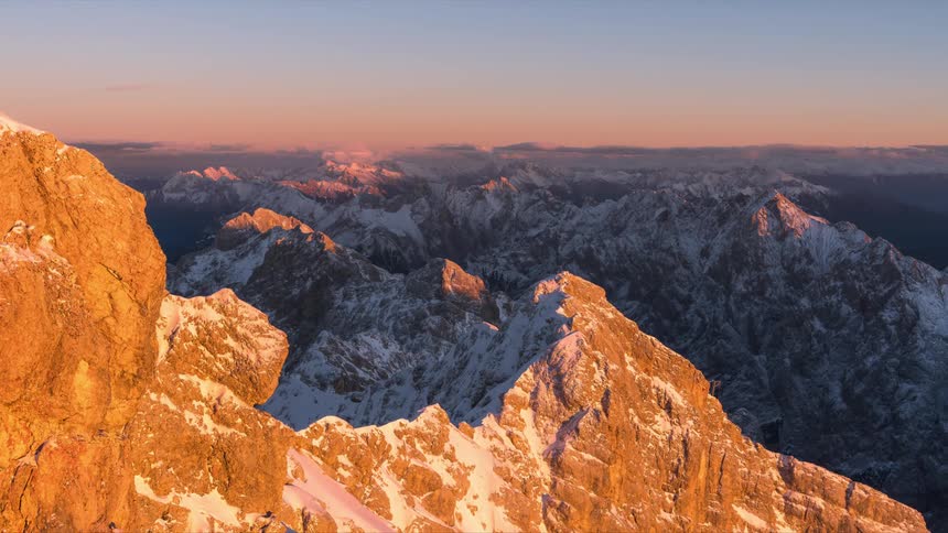 Snow dusted mountains forming large ranges
