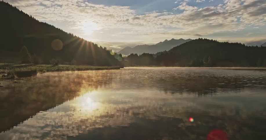 The sun is reflecting on the lake