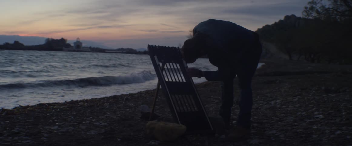 Man is working on a project on the beach