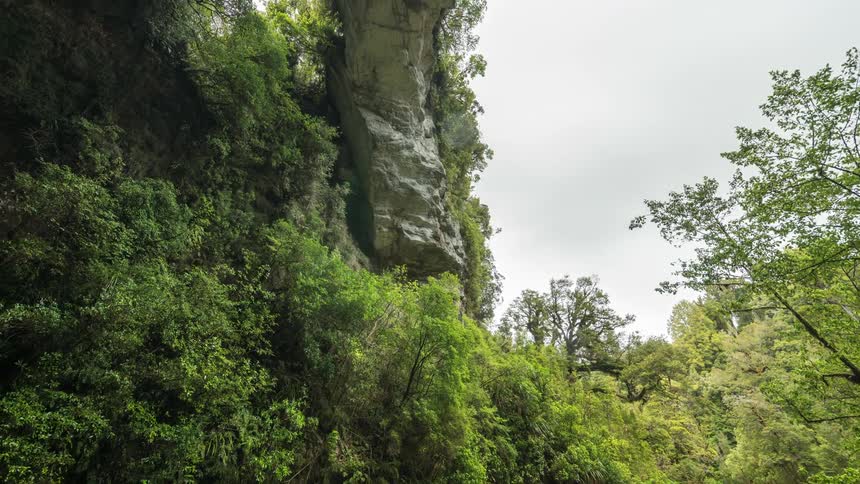 A river runs past the mountain