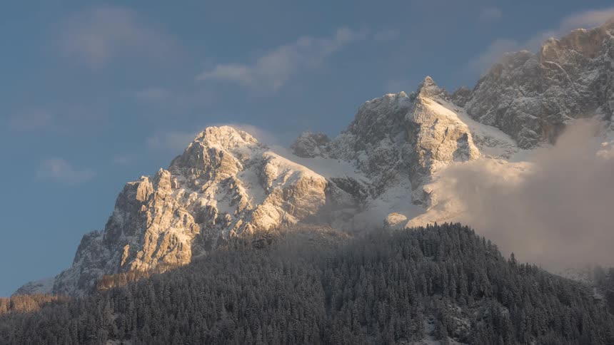 Snowy mountains bathed in sunlight