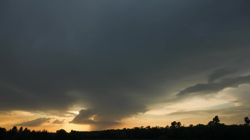 The sun shines through the storm clouds