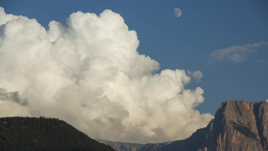 Clouds passing above mountains
