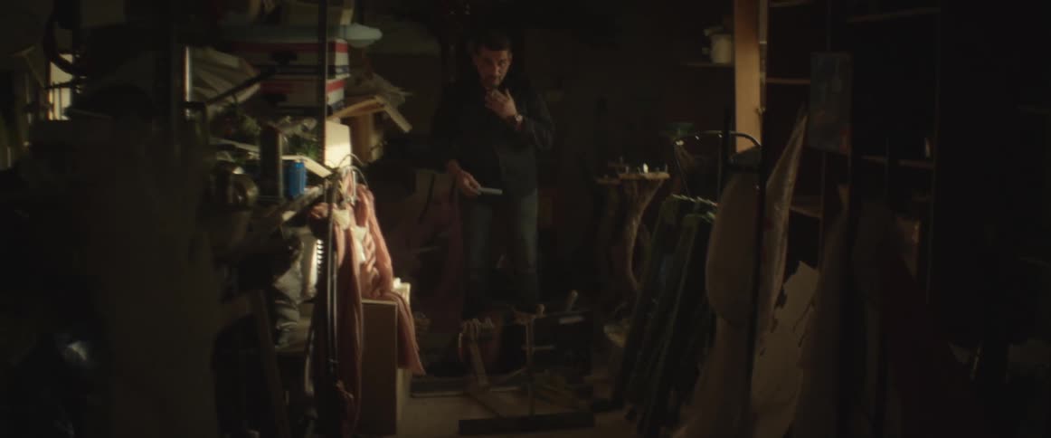 Man grabbing something in a workshop