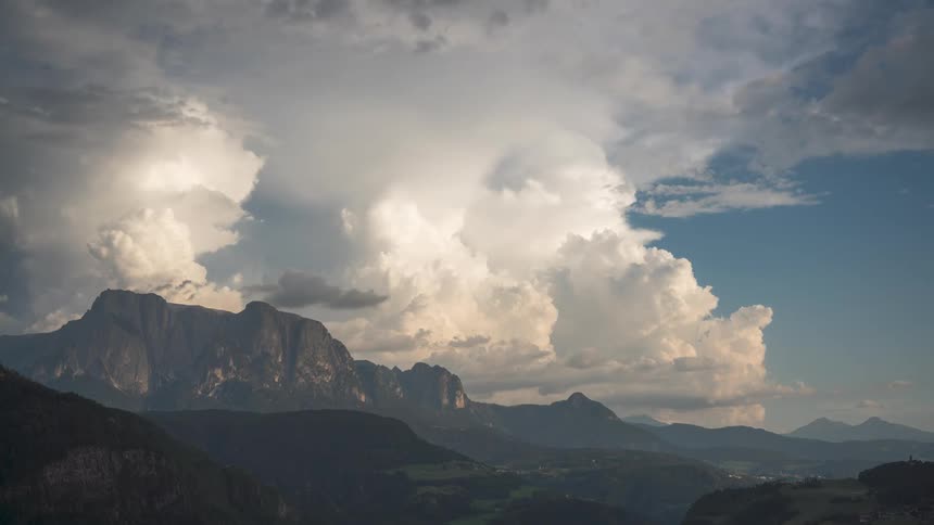 Time lapse of clouds formations over a mountainous landscape