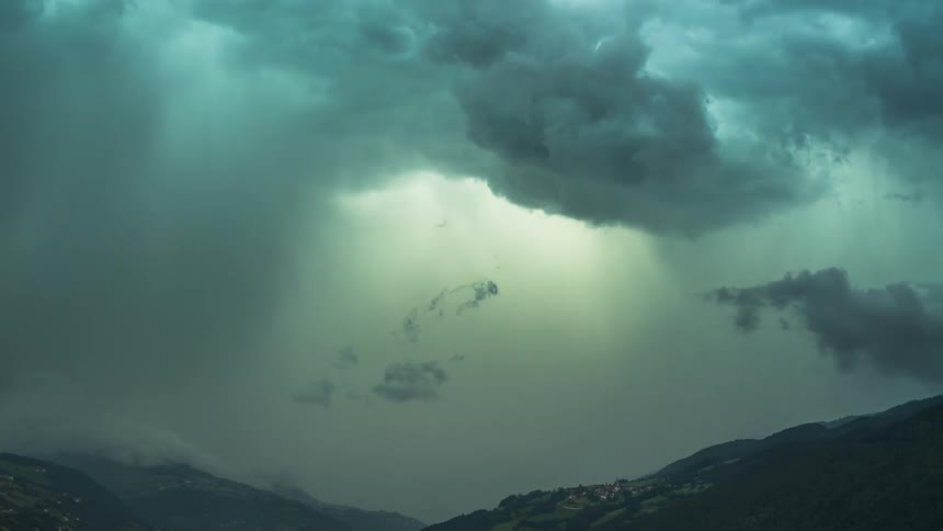 Cloudy storm above mountains