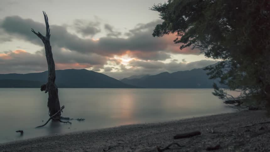 The sun sets on the lake