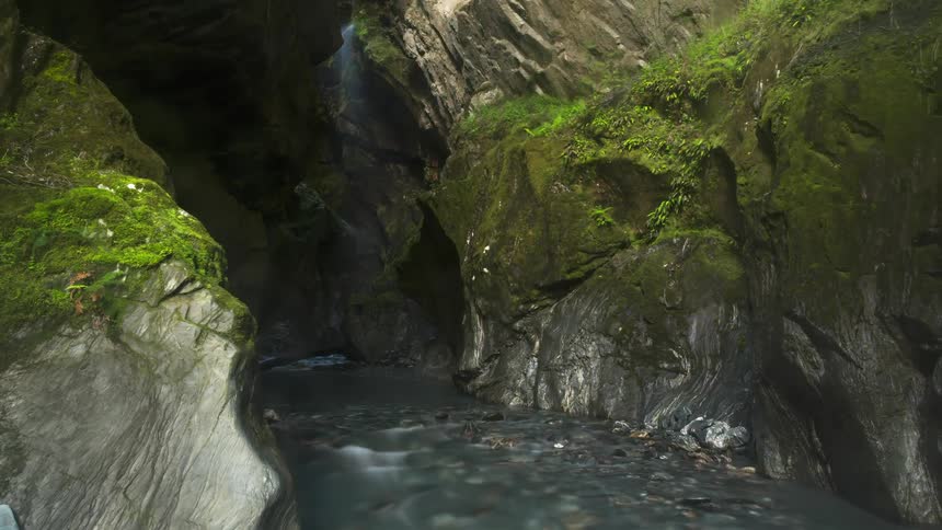 A stream runs into the cave