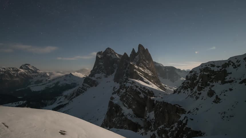 Clouds pass over the mountain peak