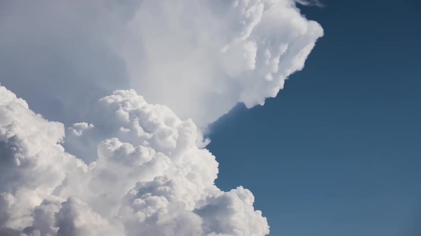 Blue sky with moving clouds
