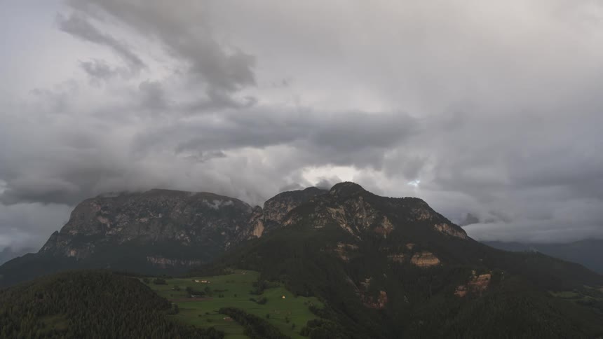 Storm clouds circle the mountain