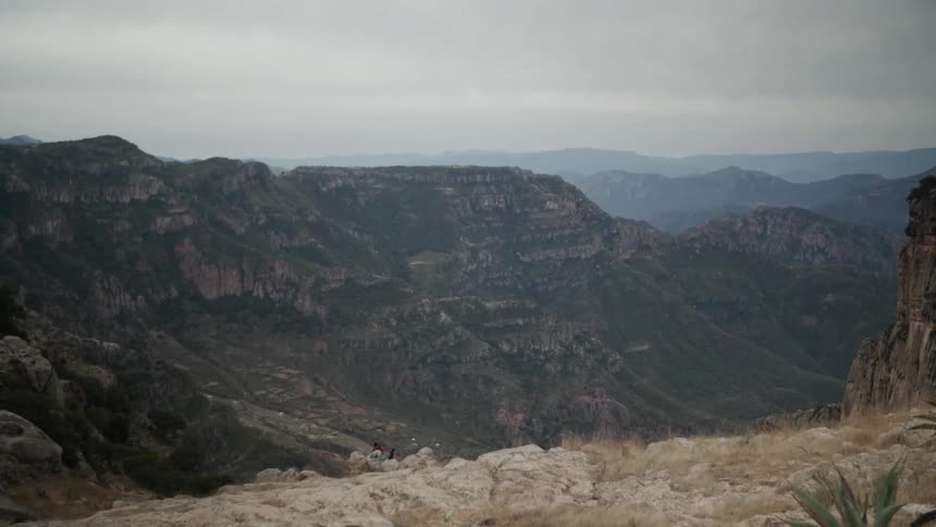 The mountain range is long and covered with clouds