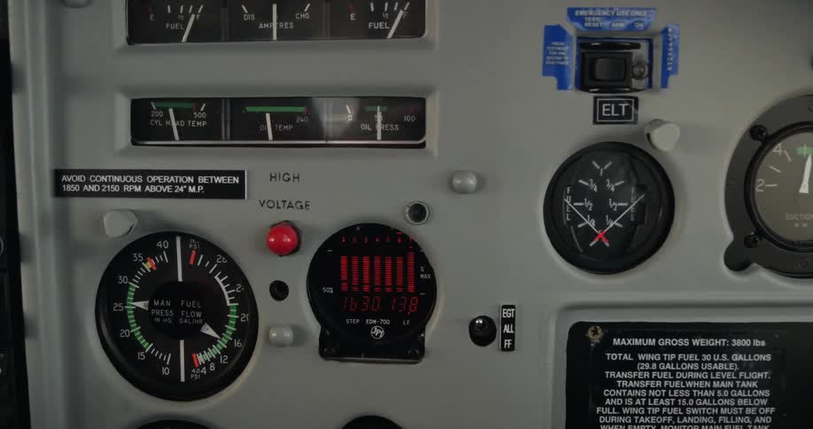 A dashboard with multiple lights and gauges