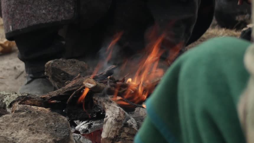 People gathered around a campfire