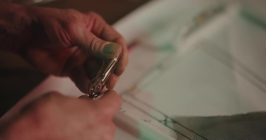 Hands handling an electrical tube