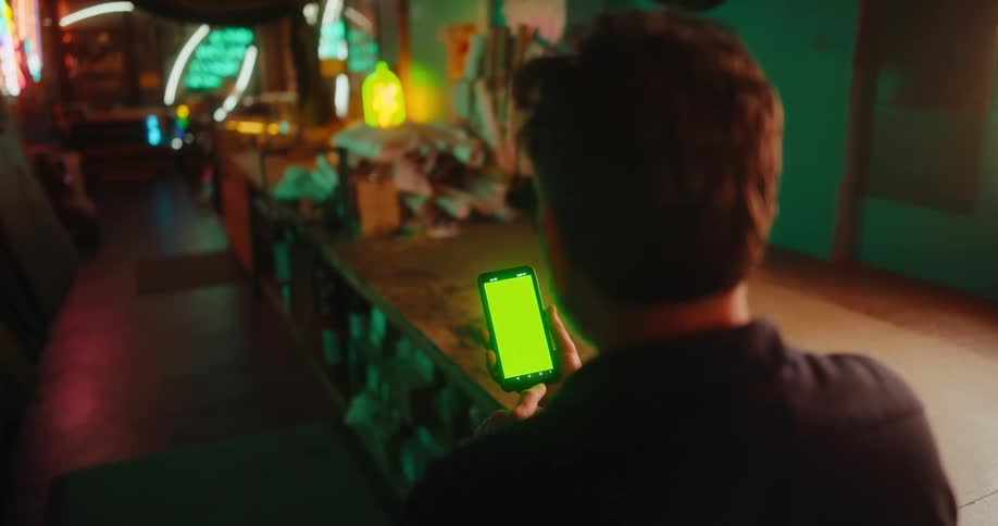Man sitting using cell phone