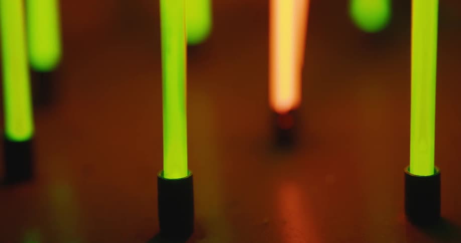 Luminous tubes on a wooden table