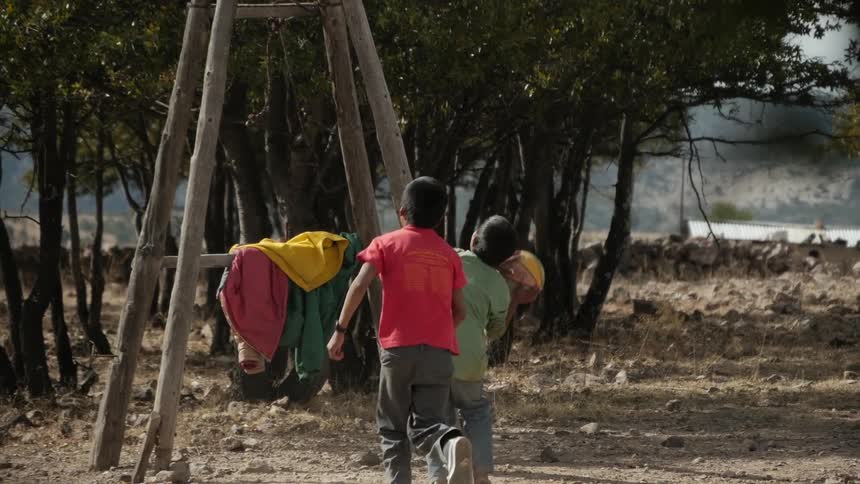 Two boys playing basketball