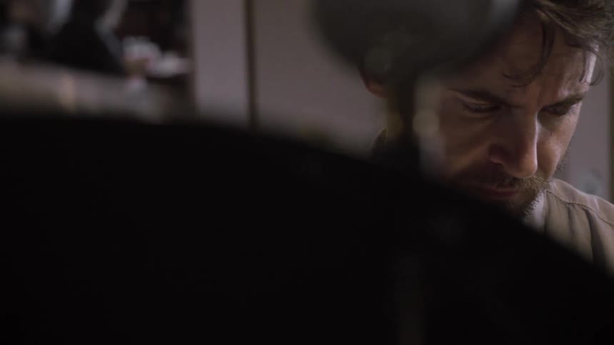 A man staring down intently
