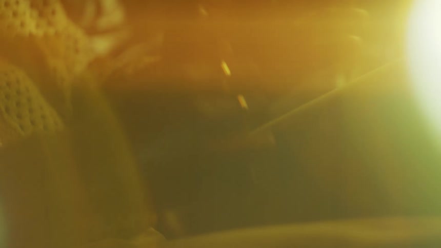 Closeup of a persons hands sitting with light reflection